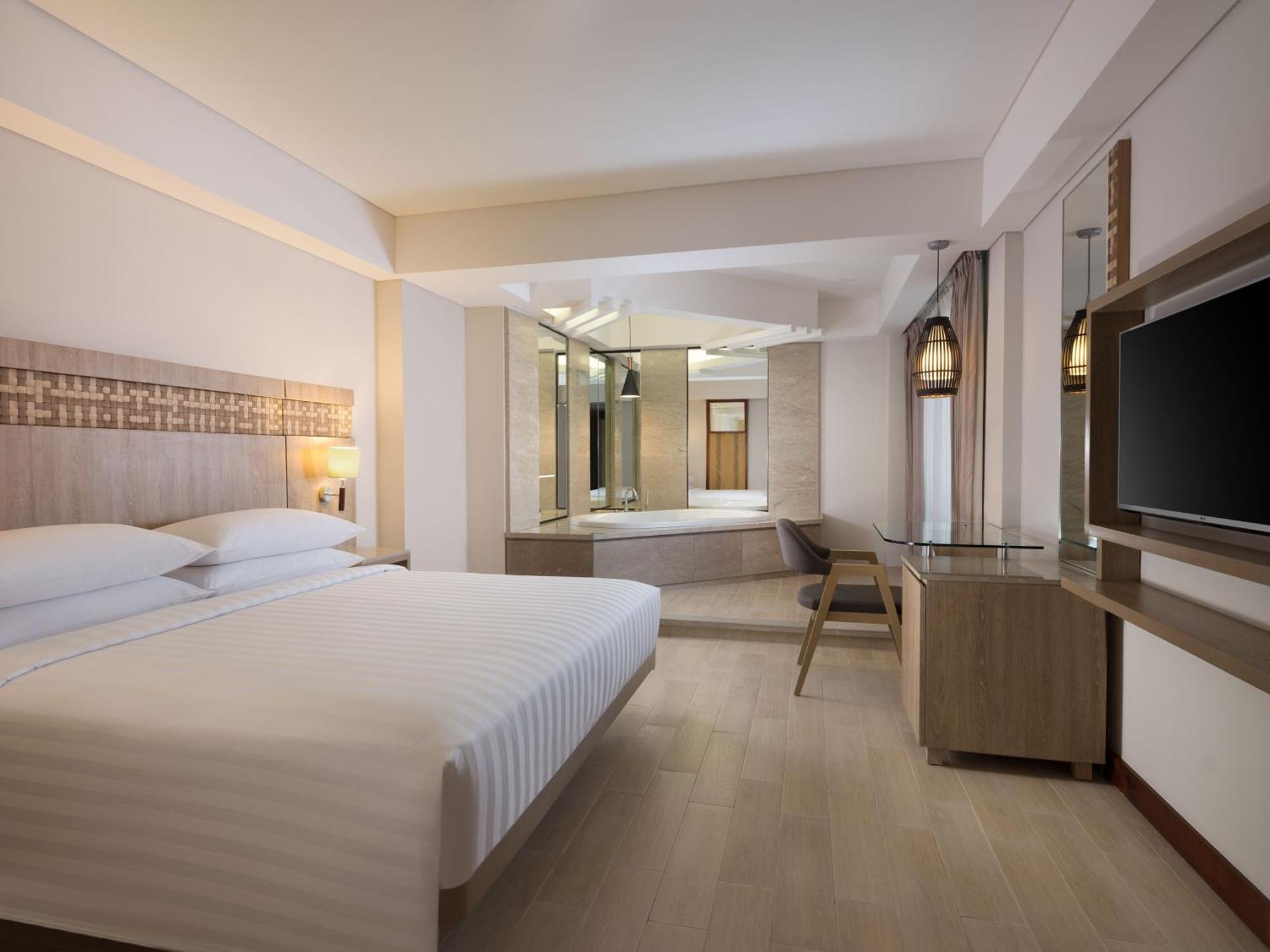 One Bedroom Junior Suite King Bed Pool view Shuttle Service to Double-Six Beach,1633039442:JPEG