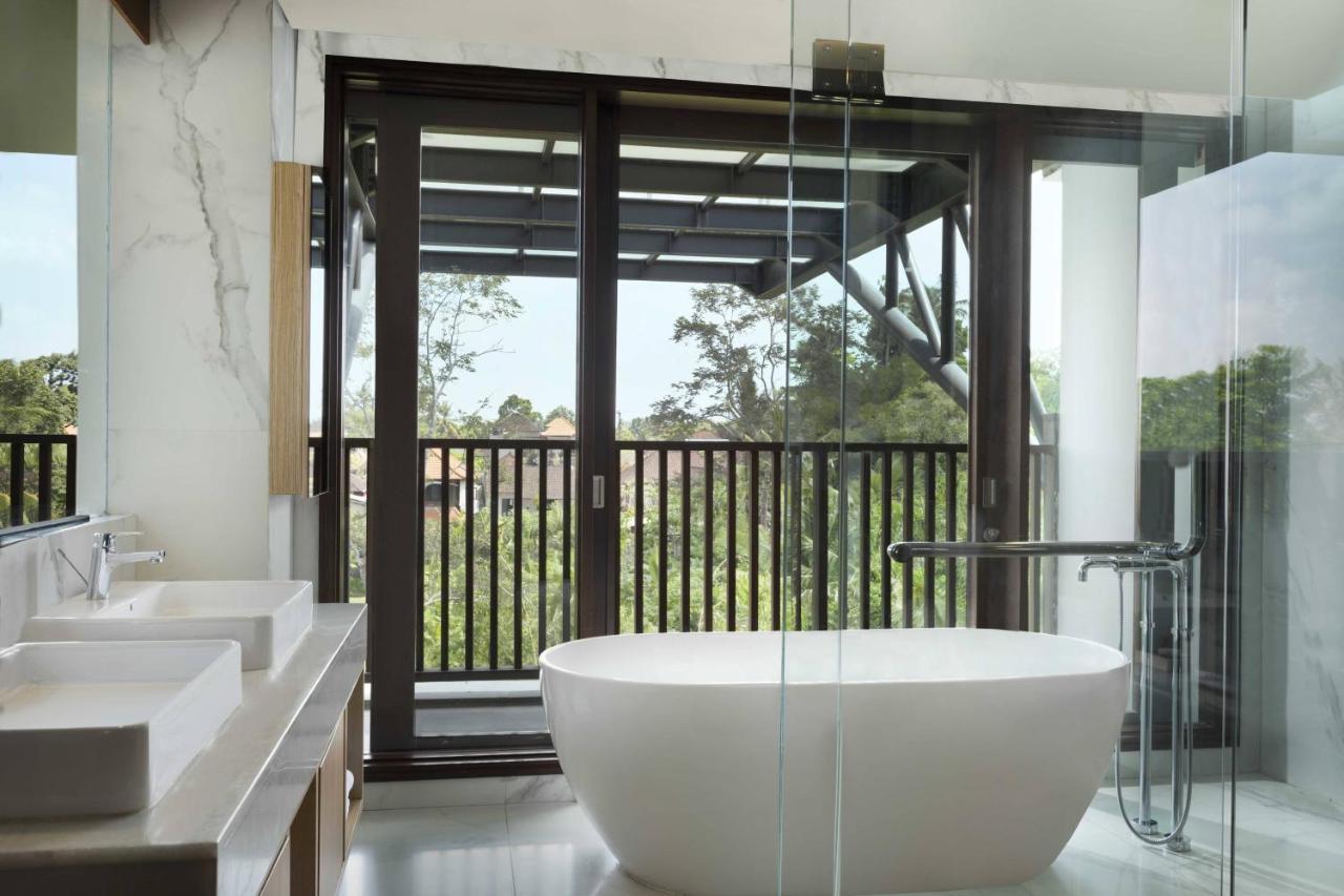Punyan Suite Room, 1 Bedroom Suite, 1 King, Garden view, Balcony with Free Mini Bar, Daily Shuttle to Monkey Forest, Daily Yoga, Free Bike to borrow,  Free Family Activity and 24 Hour access to Motion Fitness Center